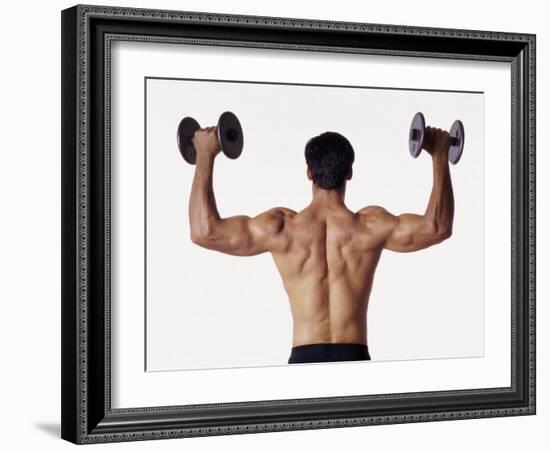 Rear View of a Man Holding Up Dumbbells-null-Framed Photographic Print