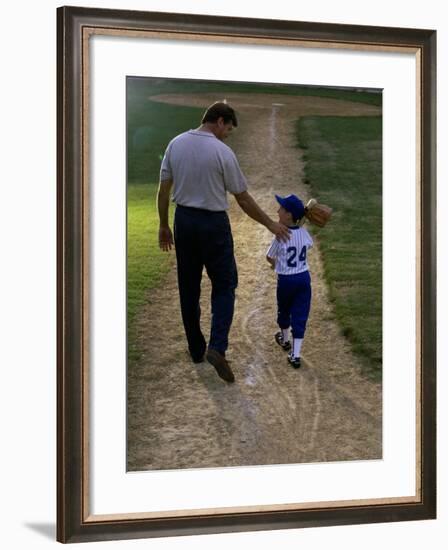 Rear View of a Man Walking with His Son at a Playing Field-null-Framed Photographic Print