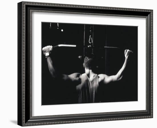 Rear View of a Young Man Exercise on a Lateral Pull-Down Weight Machine-null-Framed Photographic Print