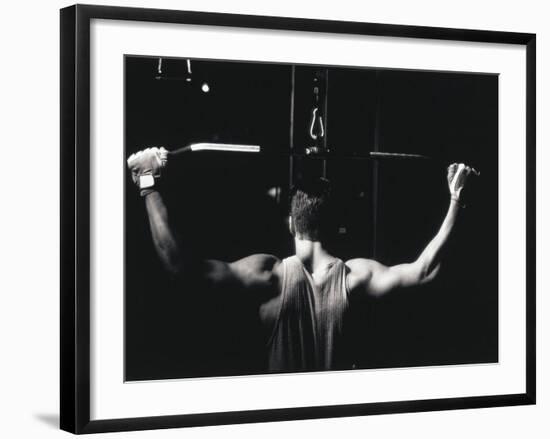 Rear View of a Young Man Exercise on a Lateral Pull-Down Weight Machine-null-Framed Photographic Print