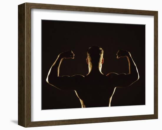 Rear View of a Young Man Flexing His Muscles-null-Framed Photographic Print