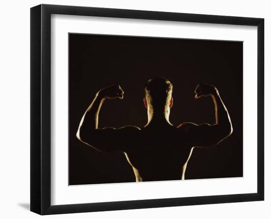 Rear View of a Young Man Flexing His Muscles-null-Framed Photographic Print