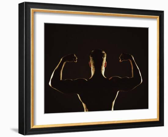Rear View of a Young Man Flexing His Muscles-null-Framed Photographic Print