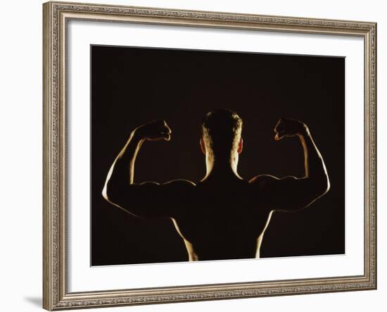 Rear View of a Young Man Flexing His Muscles-null-Framed Photographic Print