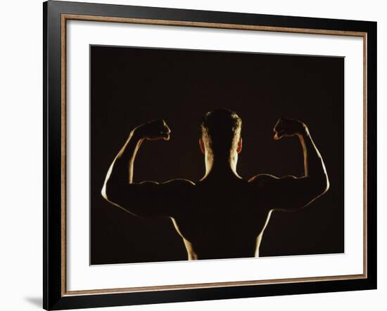 Rear View of a Young Man Flexing His Muscles-null-Framed Photographic Print