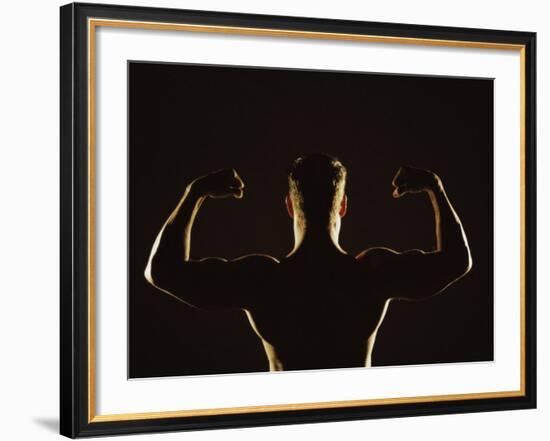 Rear View of a Young Man Flexing His Muscles-null-Framed Photographic Print