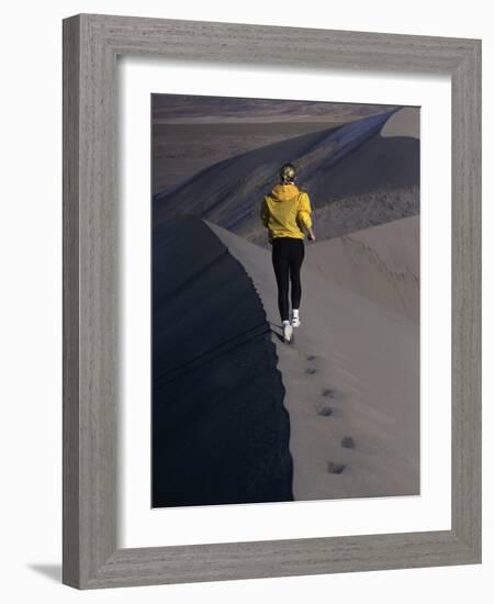 Rear View of a Young Woman Running on a Sand Dune-null-Framed Photographic Print