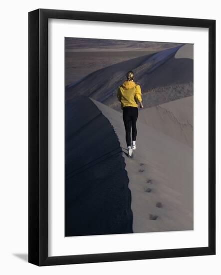 Rear View of a Young Woman Running on a Sand Dune-null-Framed Photographic Print