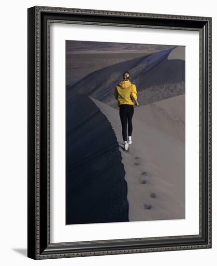 Rear View of a Young Woman Running on a Sand Dune-null-Framed Photographic Print