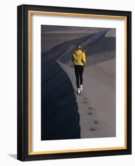 Rear View of a Young Woman Running on a Sand Dune-null-Framed Photographic Print