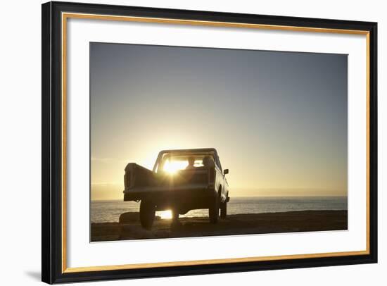 Rear View of Young Couple in Pick-Up Truck Parked in Front of Ocean Enjoying Sunset-Nosnibor137-Framed Photographic Print