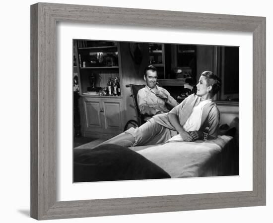 REAR WINDOW, 1954 directed byALFRED HITCHCOCK James Stewart and Grace Kelly (b/w photo)-null-Framed Photo
