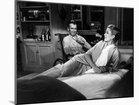 REAR WINDOW, 1954 directed byALFRED HITCHCOCK James Stewart and Grace Kelly (b/w photo)-null-Mounted Photo