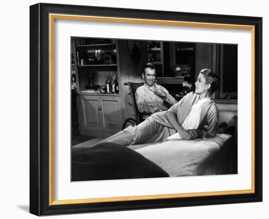 REAR WINDOW, 1954 directed byALFRED HITCHCOCK James Stewart and Grace Kelly (b/w photo)-null-Framed Photo