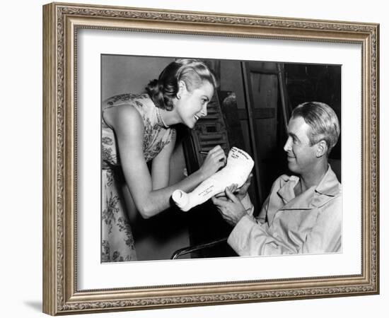 REAR WINDOW, 1954 directed byALFRED HITCHCOCK On the set, Grace Kelly and James Stewart (b/w photo)-null-Framed Photo