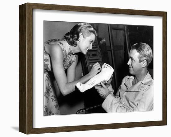 REAR WINDOW, 1954 directed byALFRED HITCHCOCK On the set, Grace Kelly and James Stewart (b/w photo)-null-Framed Photo