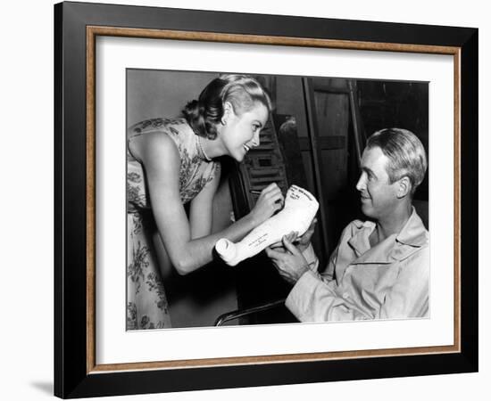 REAR WINDOW, 1954 directed byALFRED HITCHCOCK On the set, Grace Kelly and James Stewart (b/w photo)-null-Framed Photo