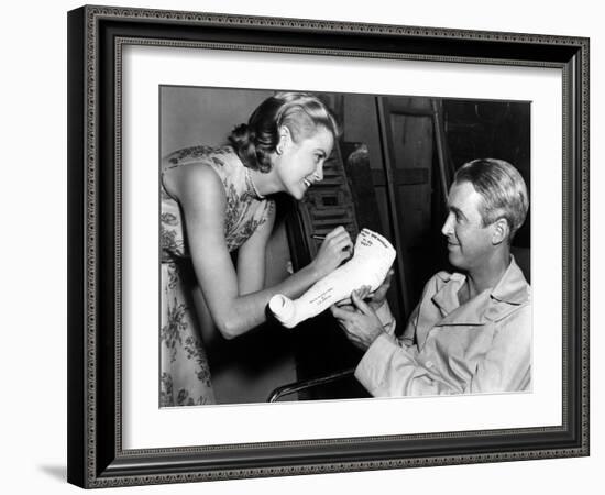 REAR WINDOW, 1954 directed byALFRED HITCHCOCK On the set, Grace Kelly and James Stewart (b/w photo)-null-Framed Photo