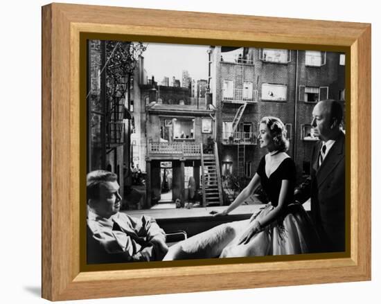 REAR WINDOW, 1954 directed byALFRED HITCHCOCK On the set, Grace Kelly between James Stewart and Alf-null-Framed Stretched Canvas