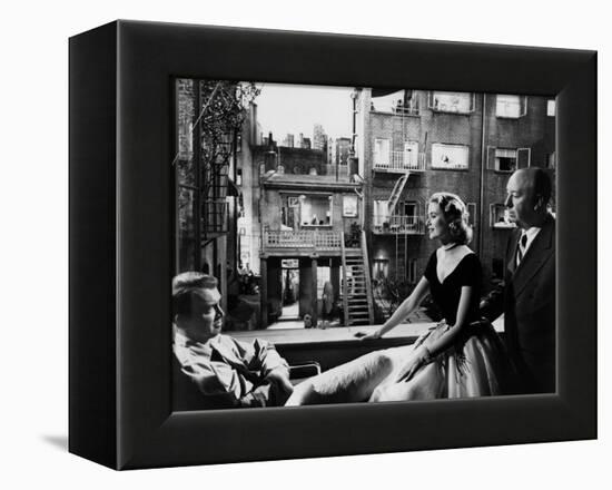 REAR WINDOW, 1954 directed byALFRED HITCHCOCK On the set, Grace Kelly between James Stewart and Alf-null-Framed Stretched Canvas