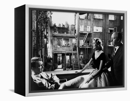 REAR WINDOW, 1954 directed byALFRED HITCHCOCK On the set, Grace Kelly between James Stewart and Alf-null-Framed Stretched Canvas