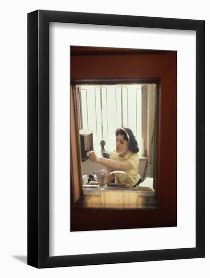 Receptionist Nancy Ricigliano at the Cindy Collins Inc Company, New York, New York, 1960-Walter Sanders-Framed Photographic Print