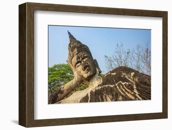 Reclining Buddha statue, Xieng Khuan, Buddha Park containing over 200 Hindu and Buddhist statues-Tom Haseltine-Framed Photographic Print