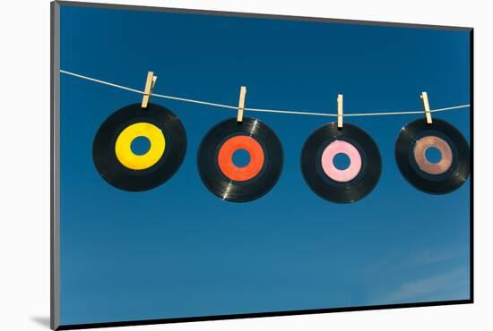 Record on A Clotheline-flippo-Mounted Photographic Print
