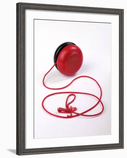 Red and Black Yoyo-null-Framed Photographic Print