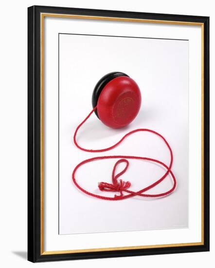 Red and Black Yoyo-null-Framed Photographic Print