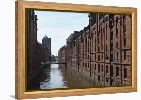 Red Brick Warehouses Overlook a Canal in the Speicherstadt District-Stuart Forster-Framed Premier Image Canvas