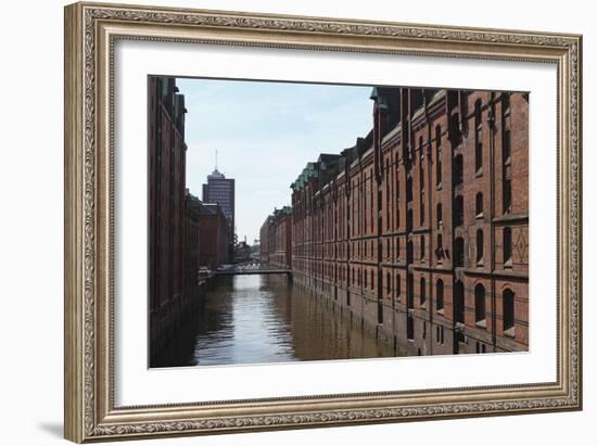 Red Brick Warehouses Overlook a Canal in the Speicherstadt District-Stuart Forster-Framed Photographic Print