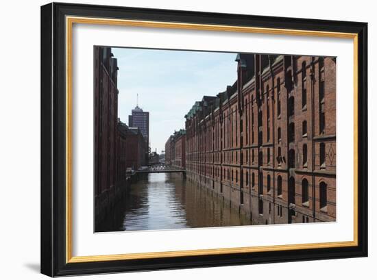 Red Brick Warehouses Overlook a Canal in the Speicherstadt District-Stuart Forster-Framed Photographic Print