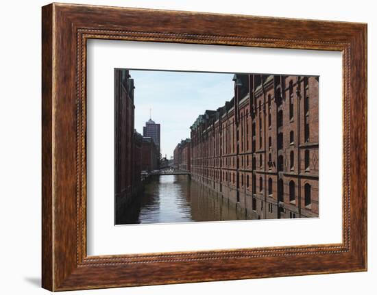 Red Brick Warehouses Overlook a Canal in the Speicherstadt District-Stuart Forster-Framed Photographic Print