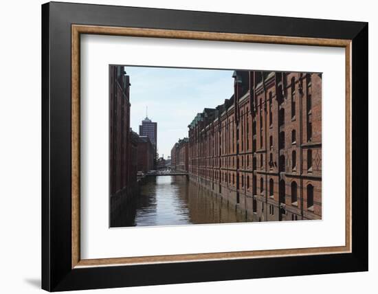 Red Brick Warehouses Overlook a Canal in the Speicherstadt District-Stuart Forster-Framed Photographic Print