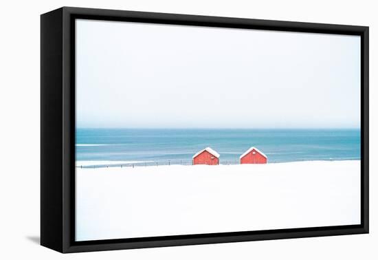 Red cabins in the snow overlooking the frozen sea, Troms county, Norway, Scandinavia, Europe-Roberto Moiola-Framed Premier Image Canvas