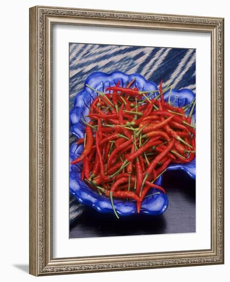 Red Chili Peppers in a Blue Bowl-Alberto Cassio-Framed Photographic Print