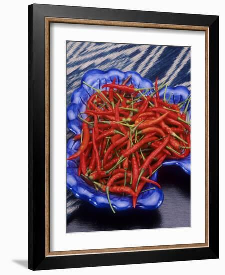 Red Chili Peppers in a Blue Bowl-Alberto Cassio-Framed Photographic Print