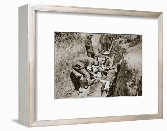 Red Cross men in the trenches tend a wounded man, Somme campaign, France, World War I, 1916-Unknown-Framed Photographic Print