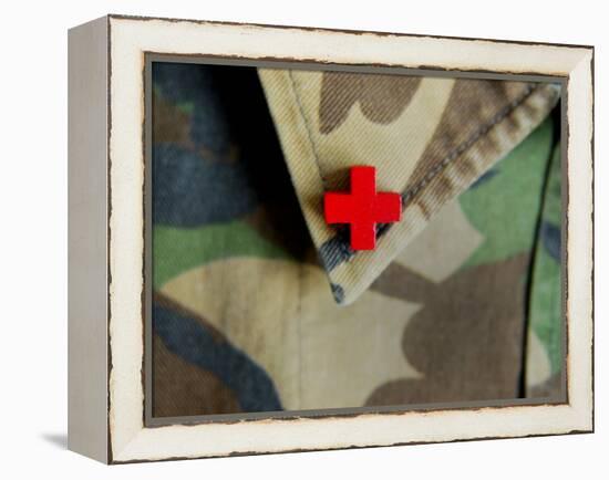 Red Cross on the Collar of a Camouflage Jacket-Winfred Evers-Framed Premier Image Canvas