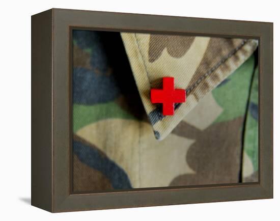 Red Cross on the Collar of a Camouflage Jacket-Winfred Evers-Framed Premier Image Canvas