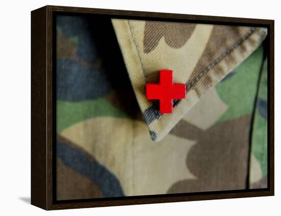 Red Cross on the Collar of a Camouflage Jacket-Winfred Evers-Framed Premier Image Canvas