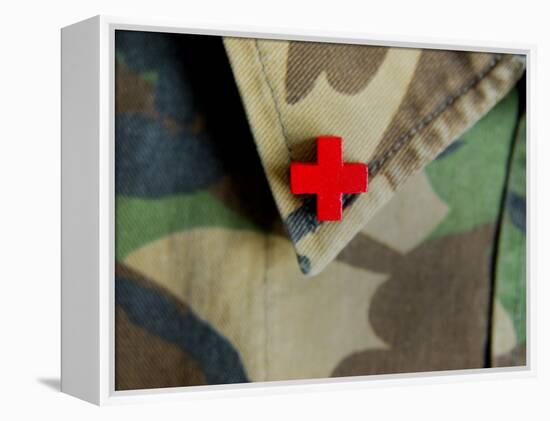 Red Cross on the Collar of a Camouflage Jacket-Winfred Evers-Framed Premier Image Canvas