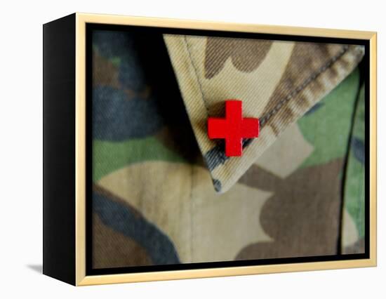 Red Cross on the Collar of a Camouflage Jacket-Winfred Evers-Framed Premier Image Canvas