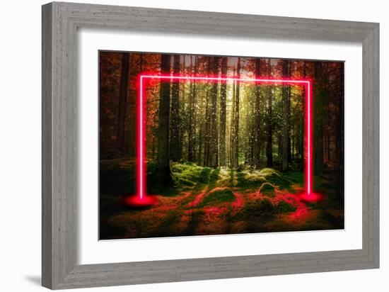 Red fluorescent neon laser lights in green magical forest landscape.-Björn Forenius-Framed Art Print