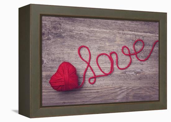 Red Heart of Red Wool Yarn on a Wooden Background-egal-Framed Premier Image Canvas