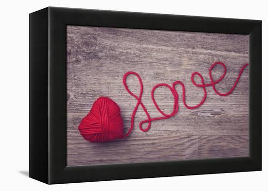 Red Heart of Red Wool Yarn on a Wooden Background-egal-Framed Premier Image Canvas