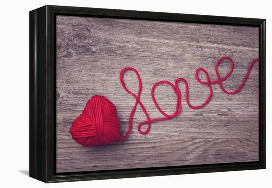 Red Heart of Red Wool Yarn on a Wooden Background-egal-Framed Premier Image Canvas