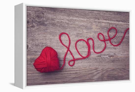 Red Heart of Red Wool Yarn on a Wooden Background-egal-Framed Premier Image Canvas