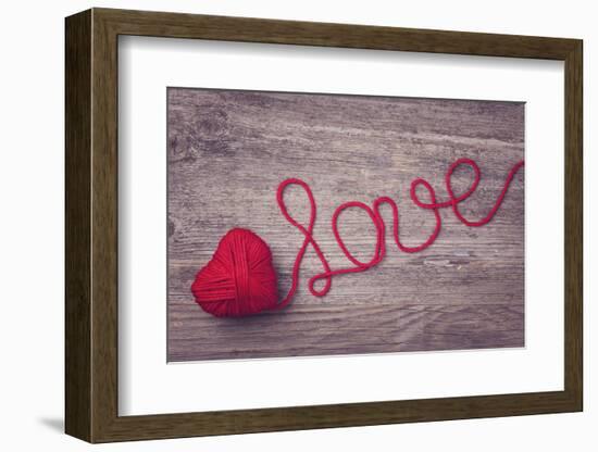 Red Heart of Red Wool Yarn on a Wooden Background-egal-Framed Photographic Print
